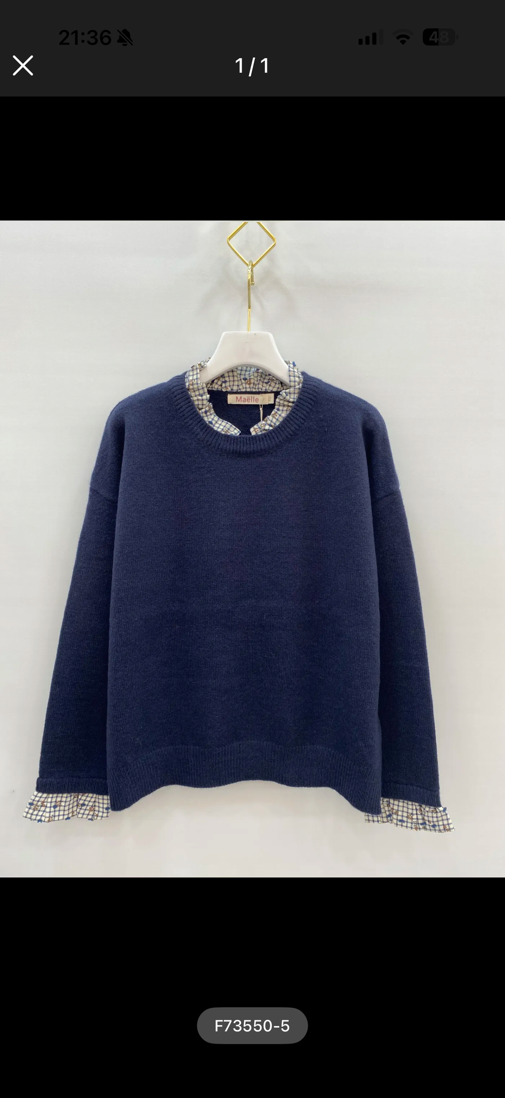 Pull marine à détails carreaux