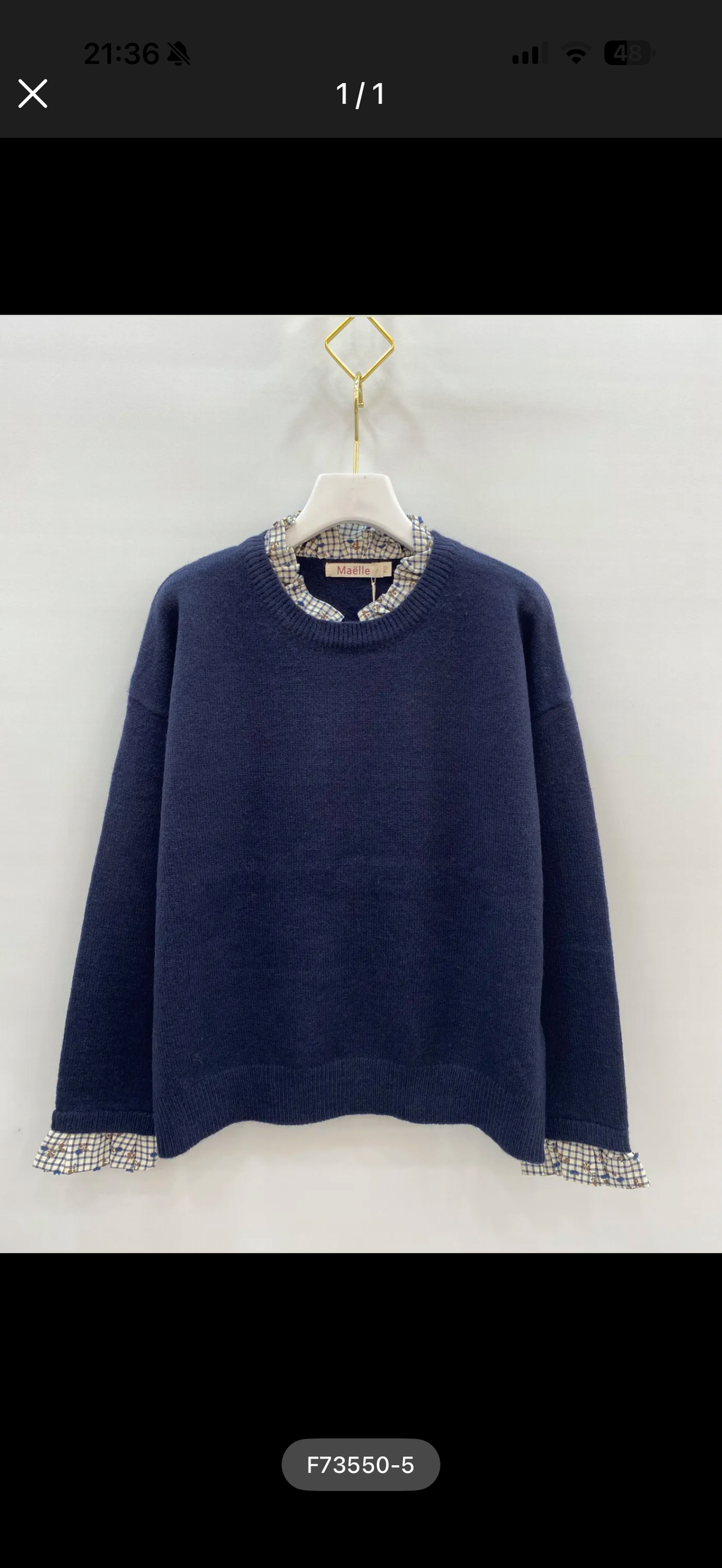 Pull marine à détails carreaux